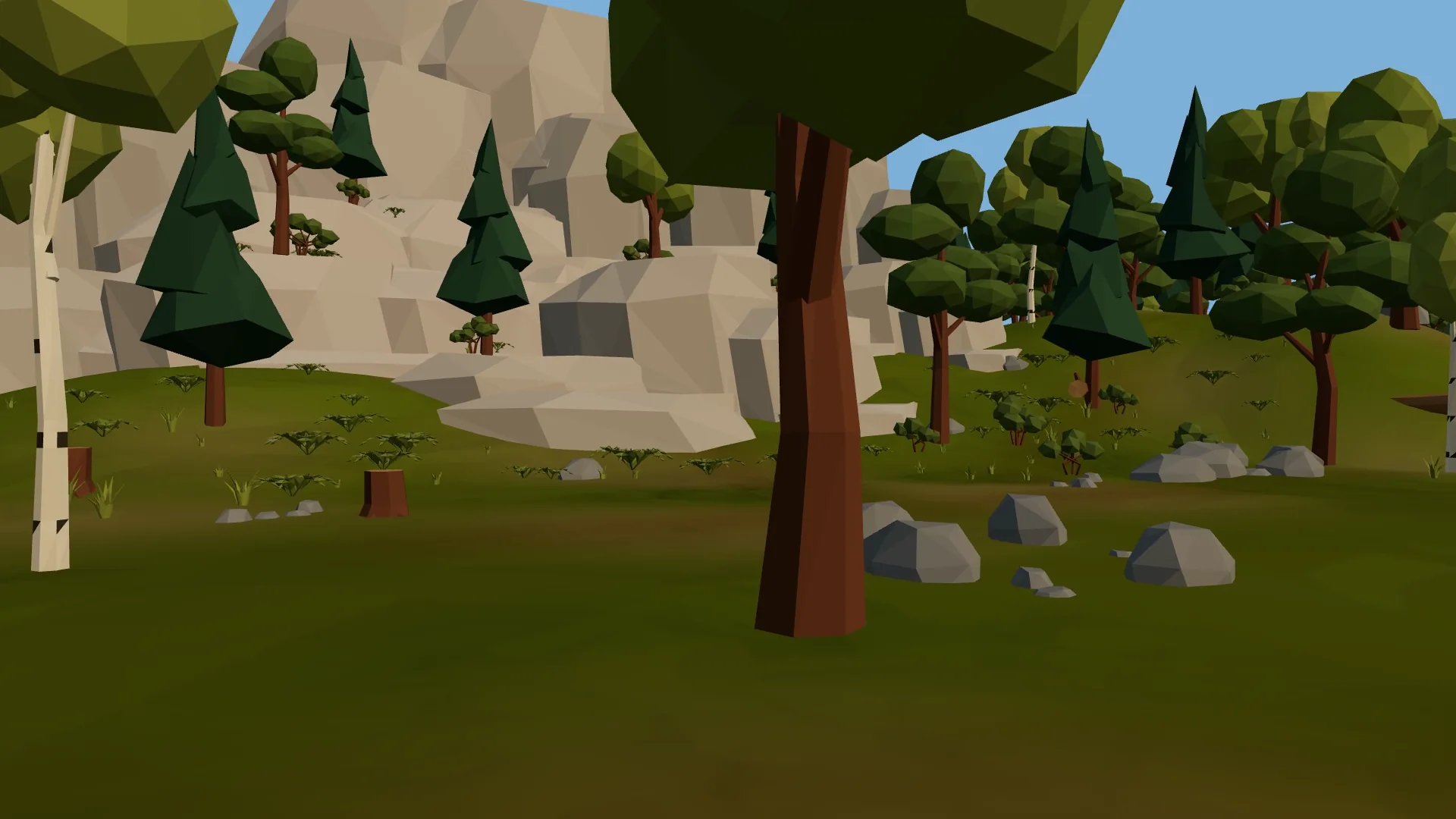 Blick in die VR21-Steinzeitwelt: Bäume, Felsen und eine helle Felswand.
